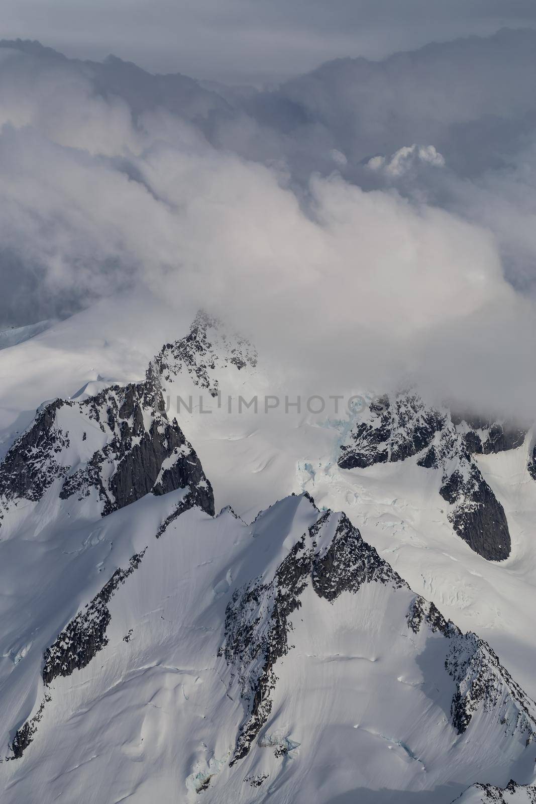 Remote mountain peak covered in snow in British Columbia. Aerial Background by edb3_16