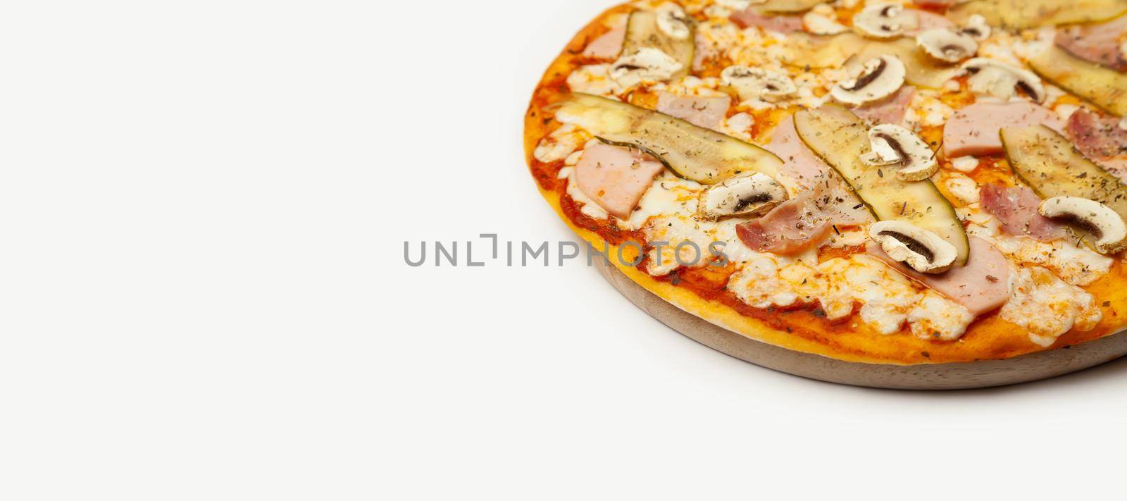 Delicious Meat pizza served on a wooden plate, ingredients Signature sauce, mozzarella cheese, ham, bacon, pickled cucumber, mushrooms on white. Pizzeria promotion poster.