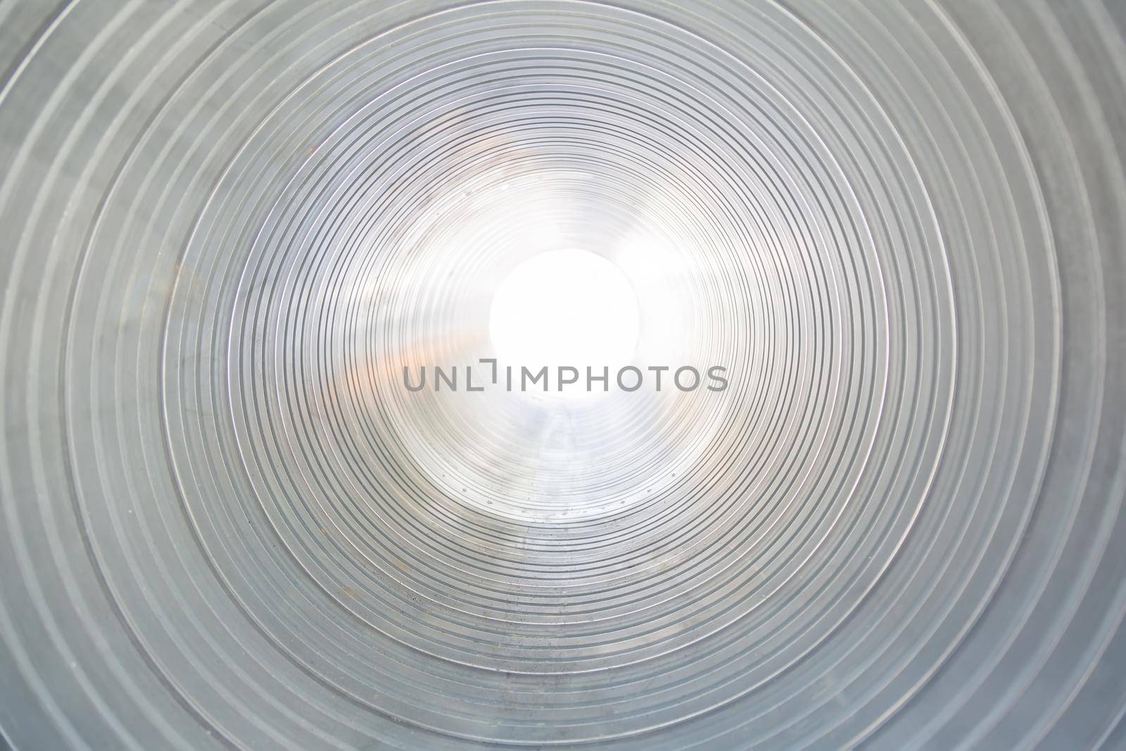 The ventilation pipe is round from the inside. Steel pipes, parts for the construction of industrial air conditioning ducts inside the pipe. Industrial ventilation equipment