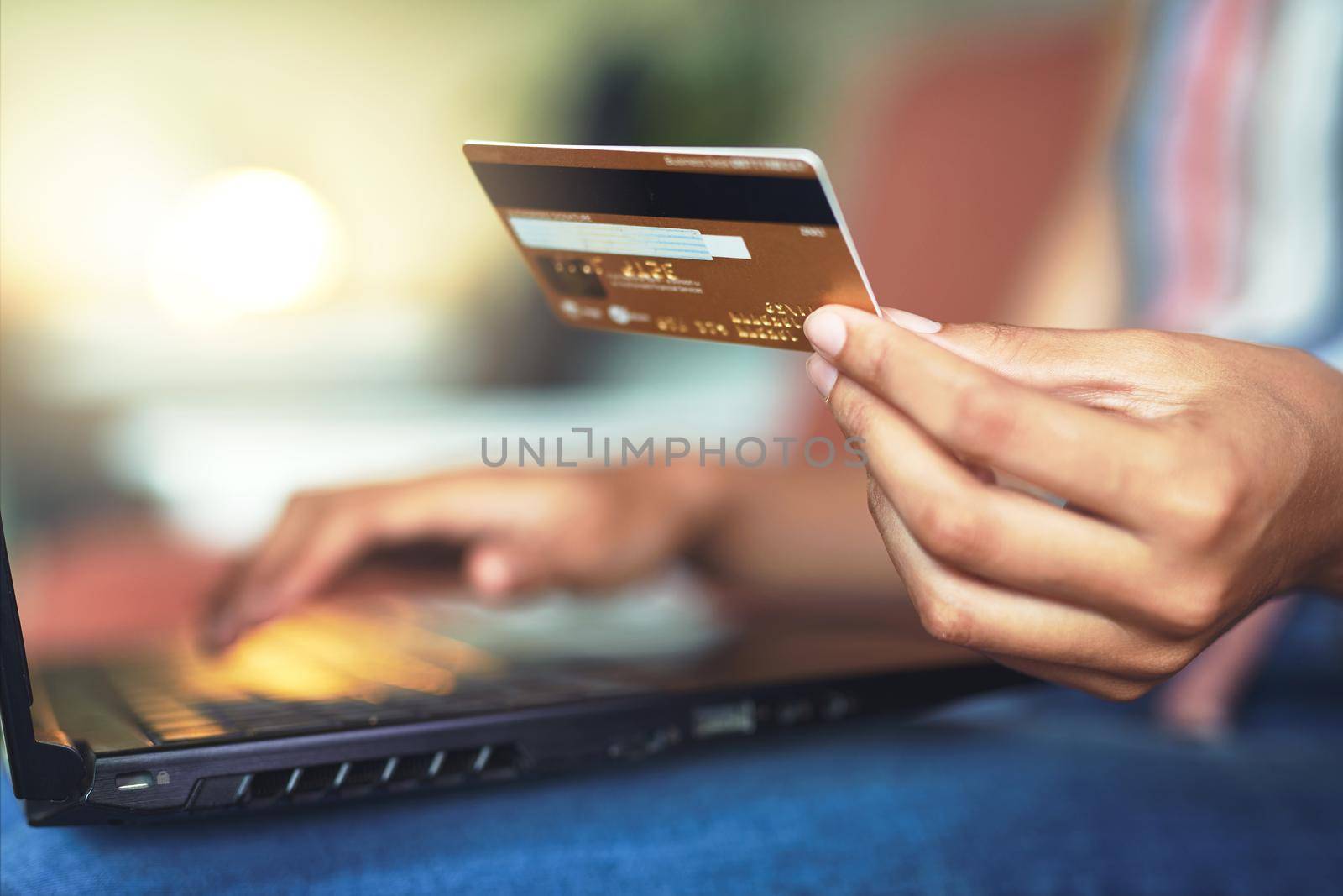 Cropped shot of a beautiful African woman doing online payment