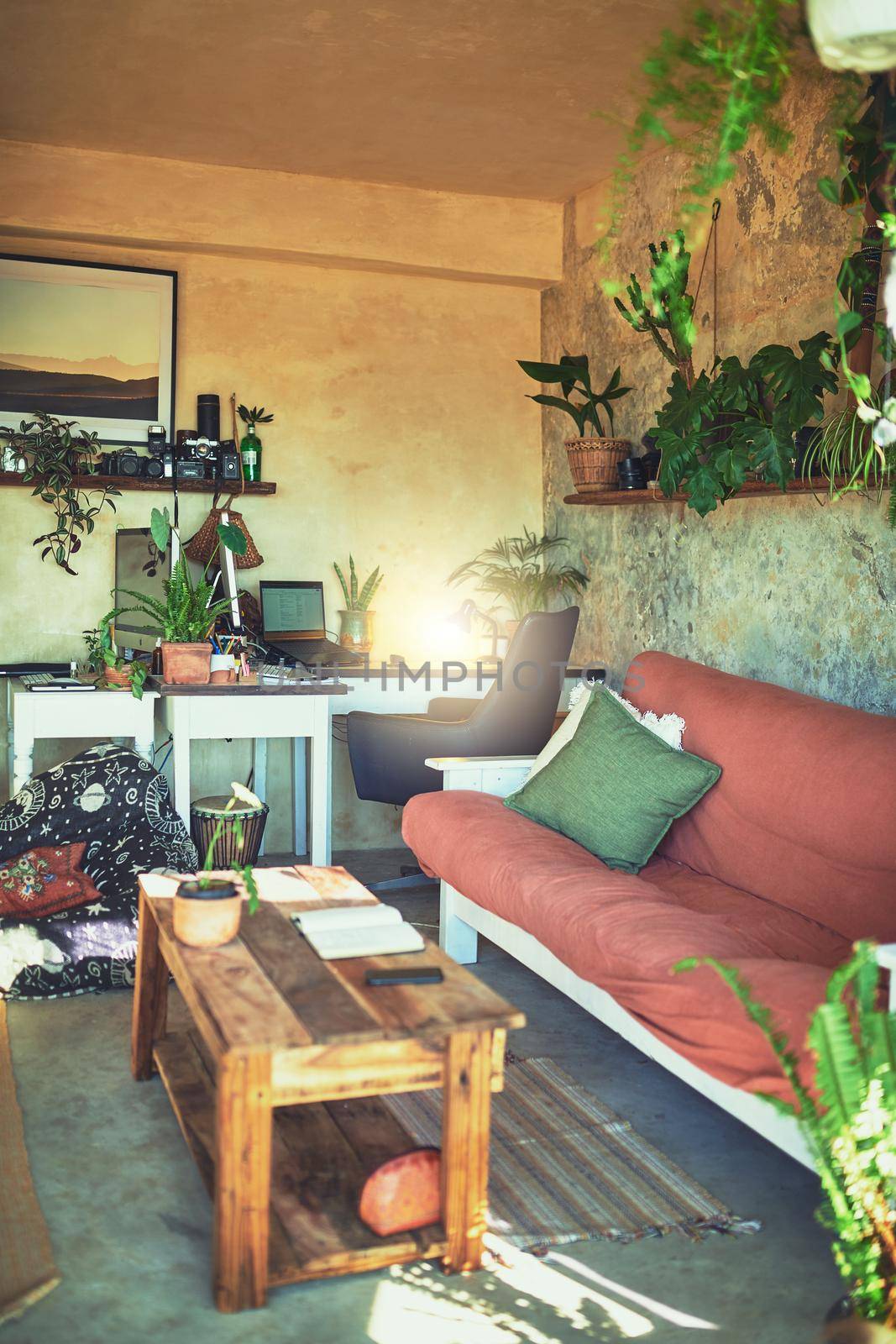 Still life shot of a workstation in the living room of a rustic apartment