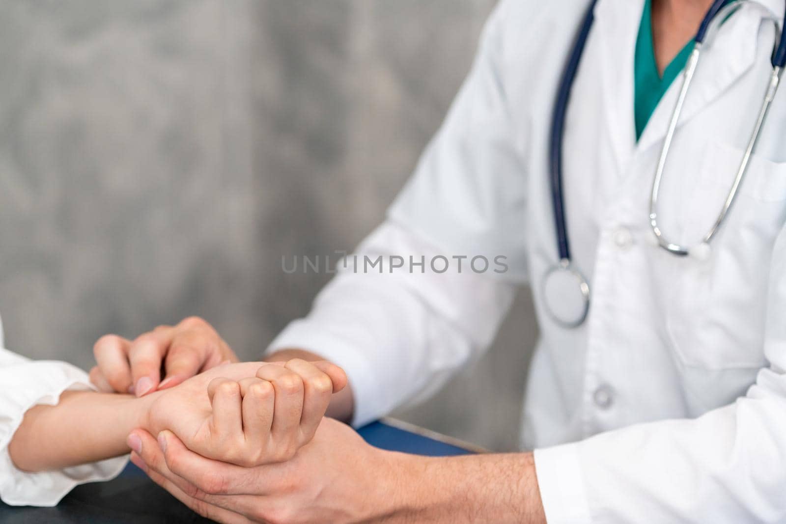 Young doctor examining female patient in hospital office. Medical healthcare and doctor staff service concept.