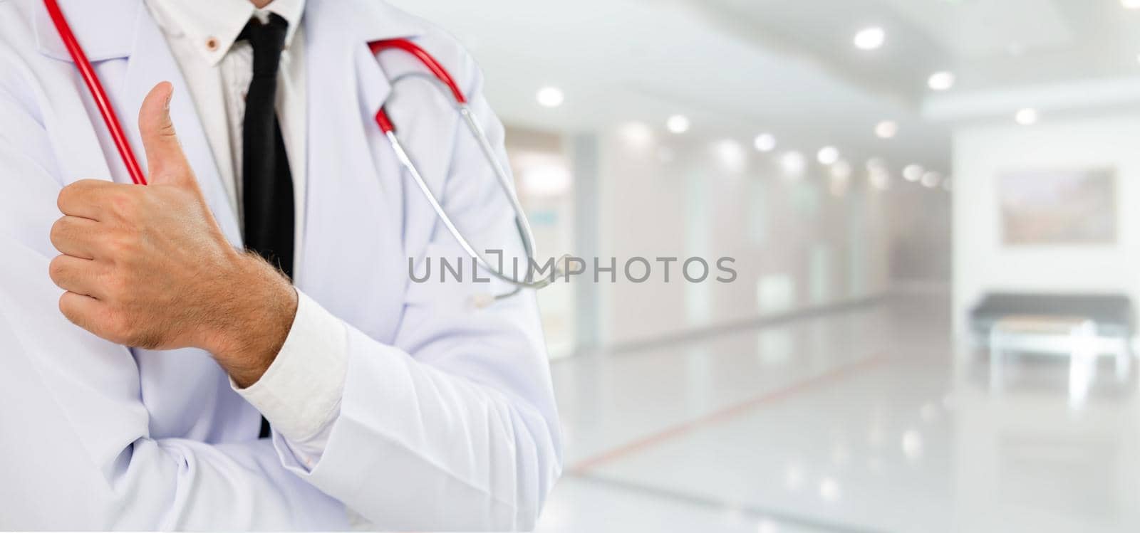 Young male doctor working at the hospital. Medical healthcare and doctor staff service.