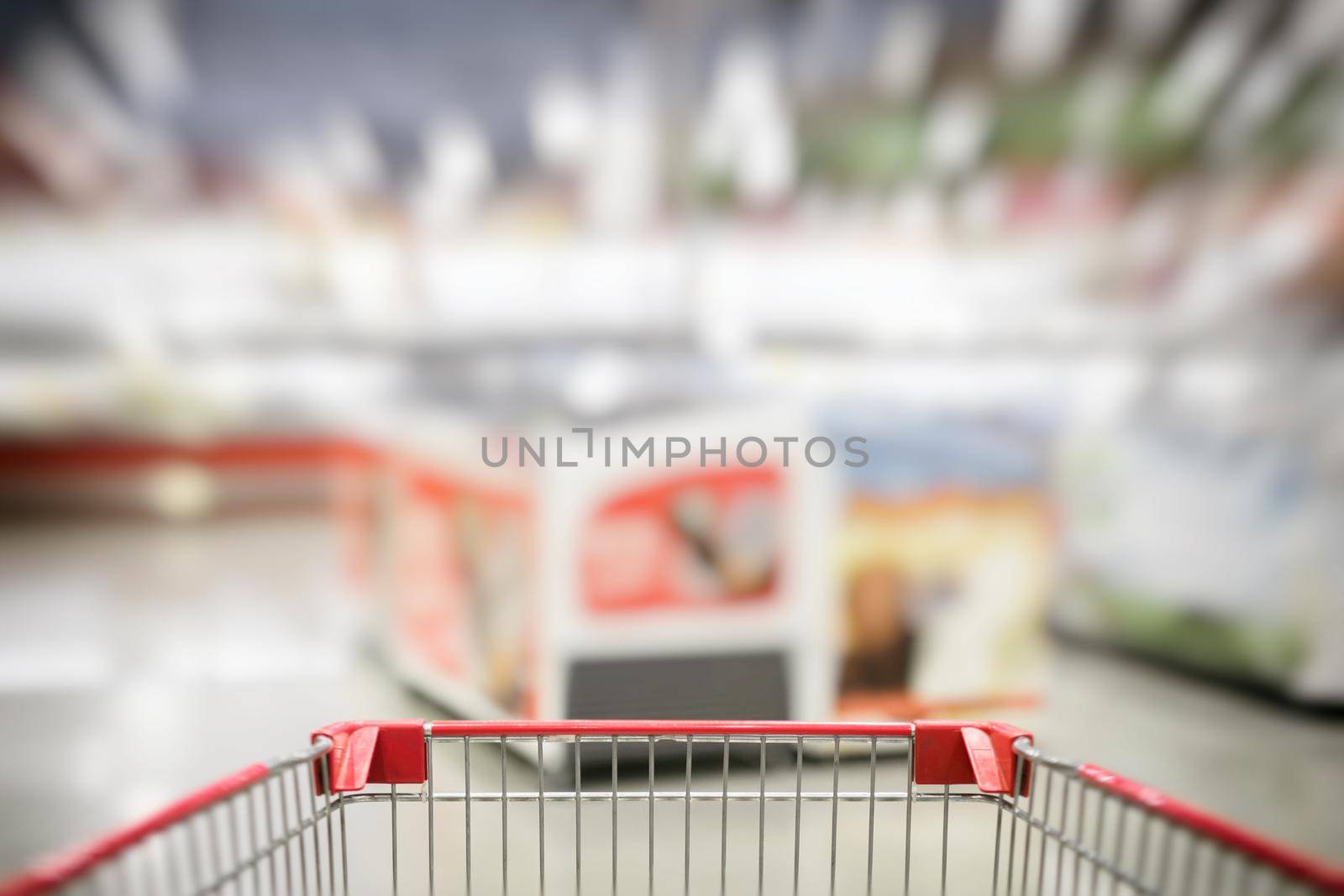 Blurred photo of store with trolley in department store bokeh background by Rom4ek