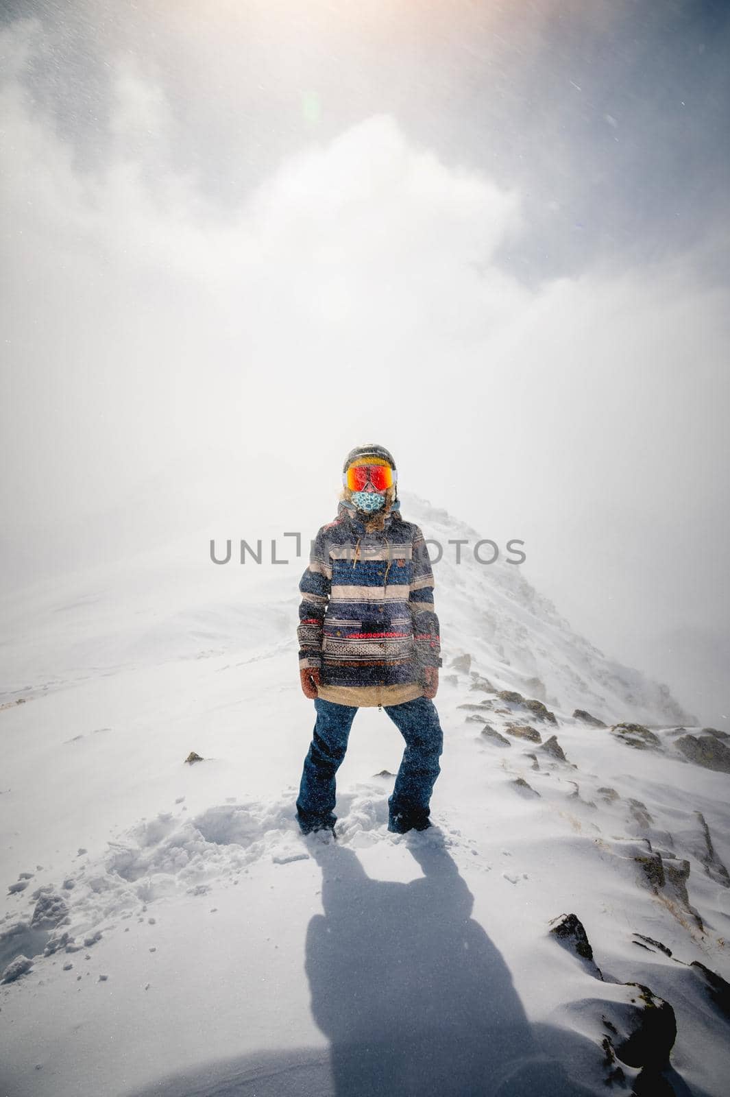 Portrait of a pretty and active woman skier, wearing a mask, active winter holidays. extreme lifestyle concept