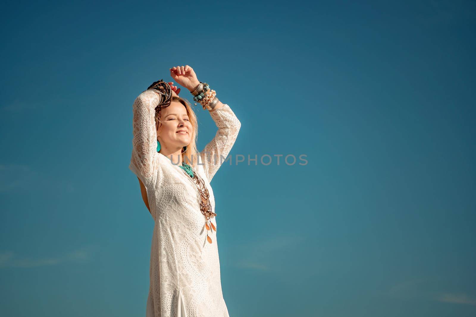 fashionable young model in boho style dress