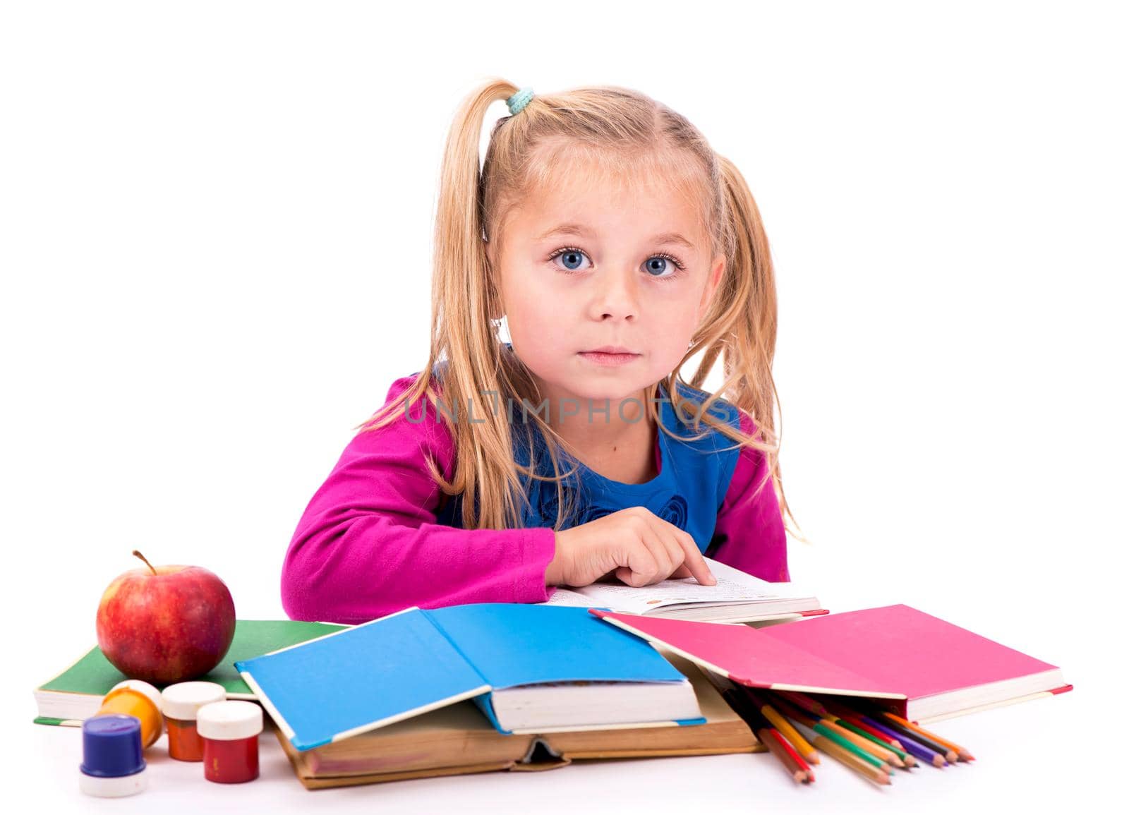 Little smart girl holding a book and reading it, on a white background by aprilphoto