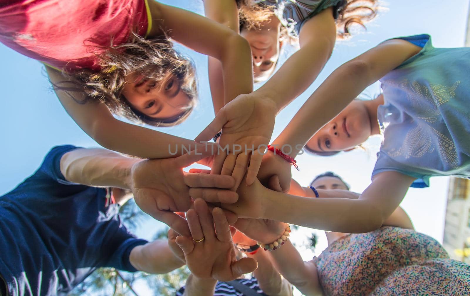 People put their hands together. Selective focus. by yanadjana