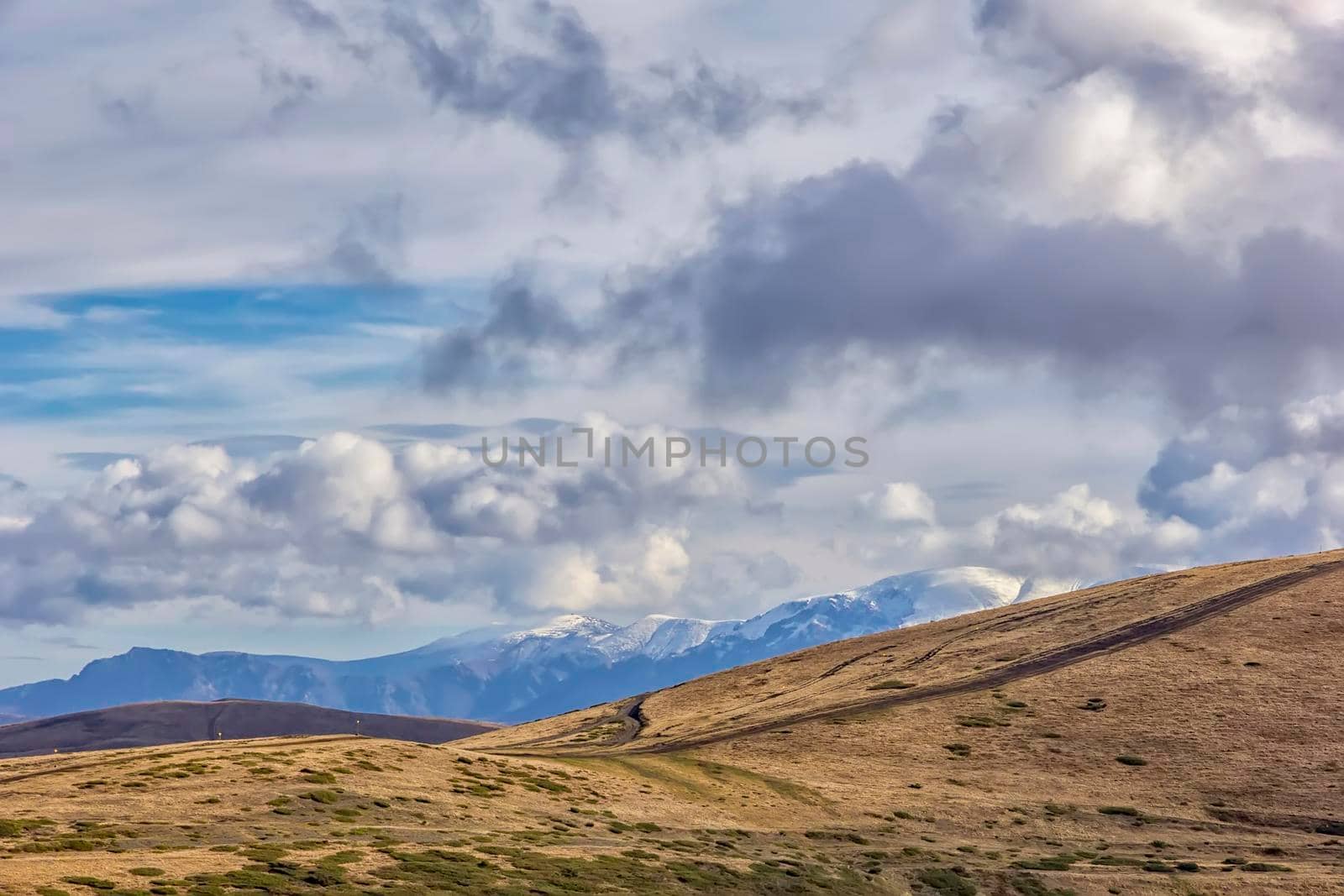 Beauty view of a mountain and mountain hills with snow