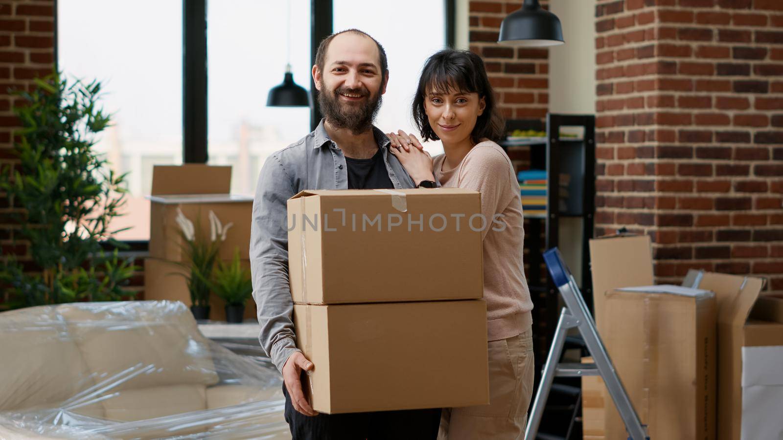 Portrait of life partners buying house on loan to move in by DCStudio