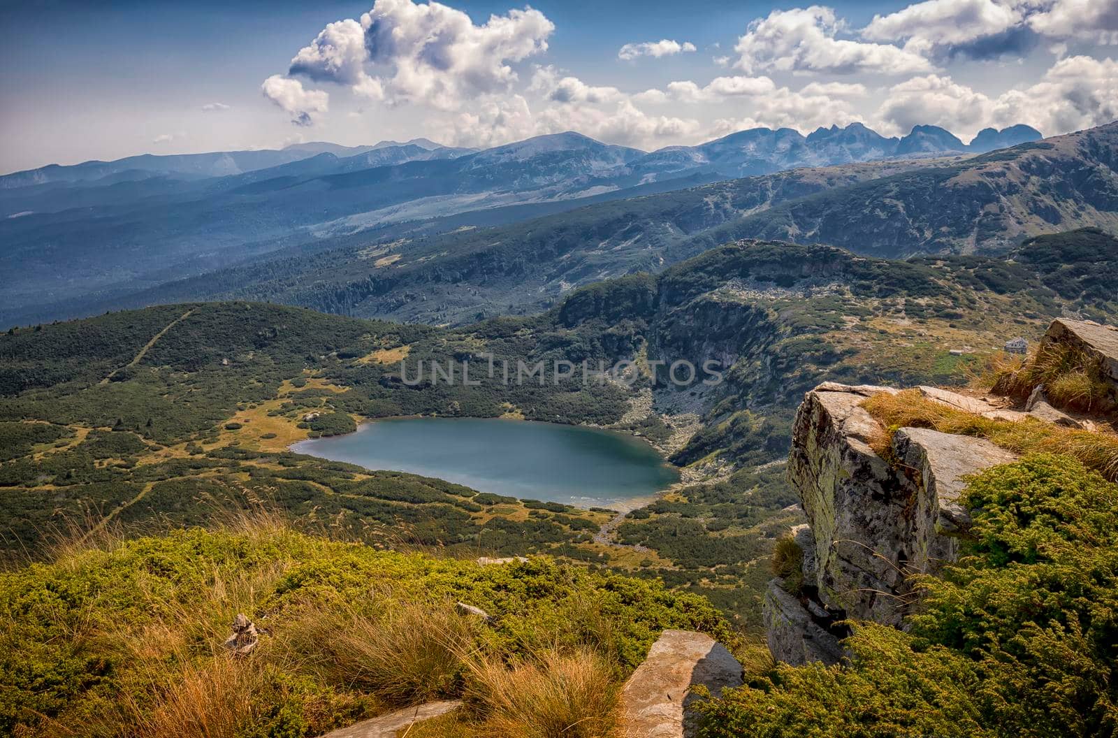 beauty scenic view from peak to a mountain lake