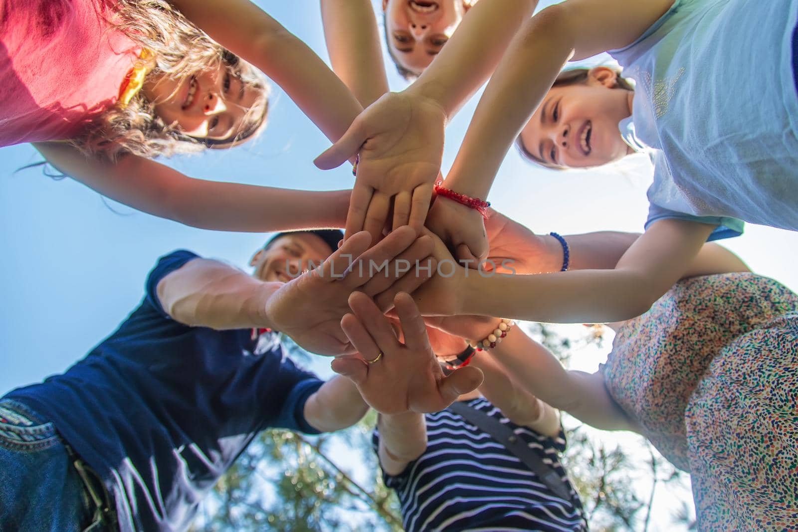 People put their hands together. Selective focus. by yanadjana