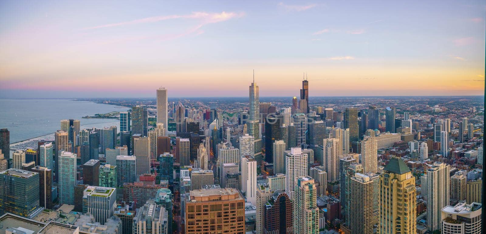 Aerial view of Chicago downtown skyline at sunset from high above.