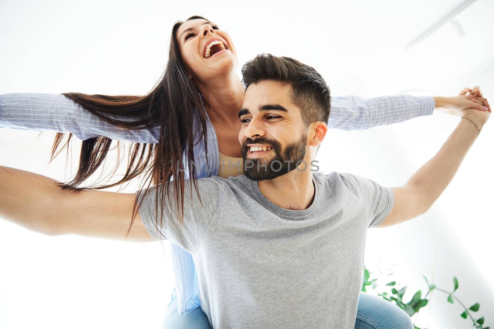 Portrait of a lovely young couple together at home