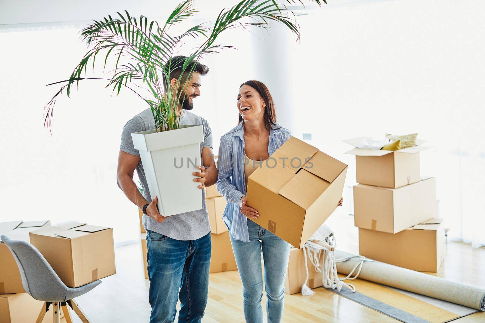 Portrait of a lovely young couple moving in a new house