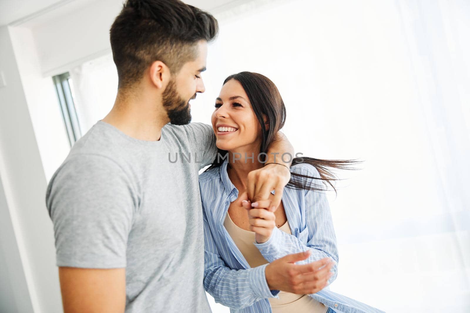 Portrait of a lovely young couple together at home