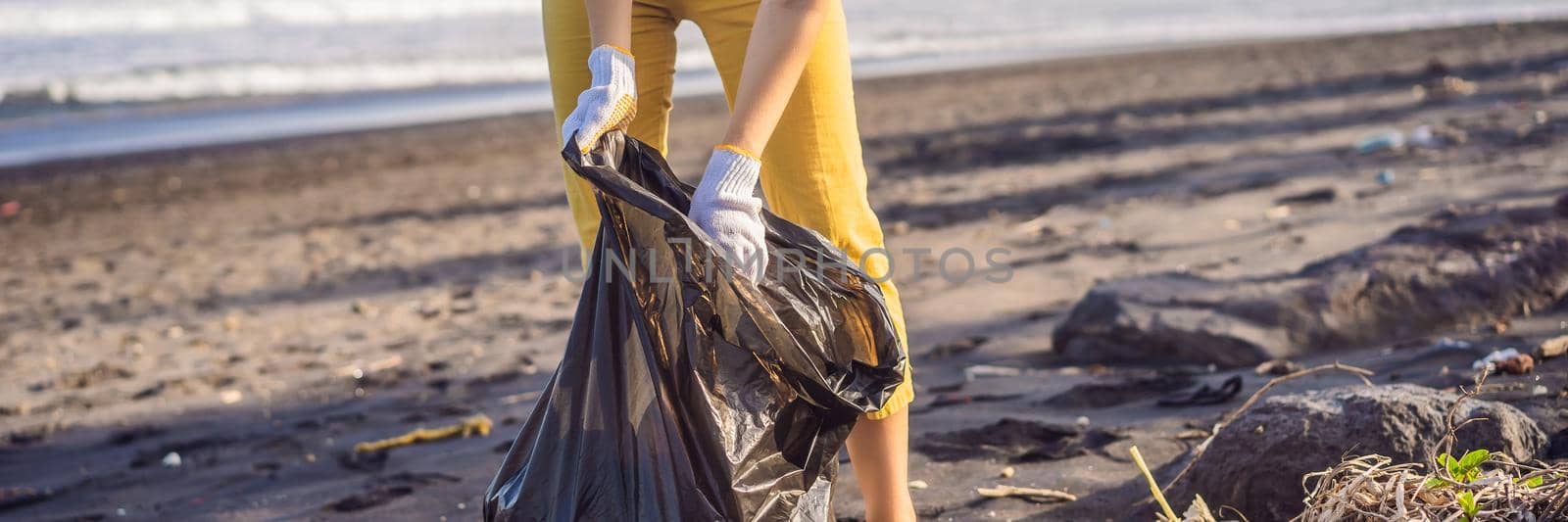 Mother and son are cleaning up the beach. Natural education of children BANNER, LONG FORMAT by galitskaya