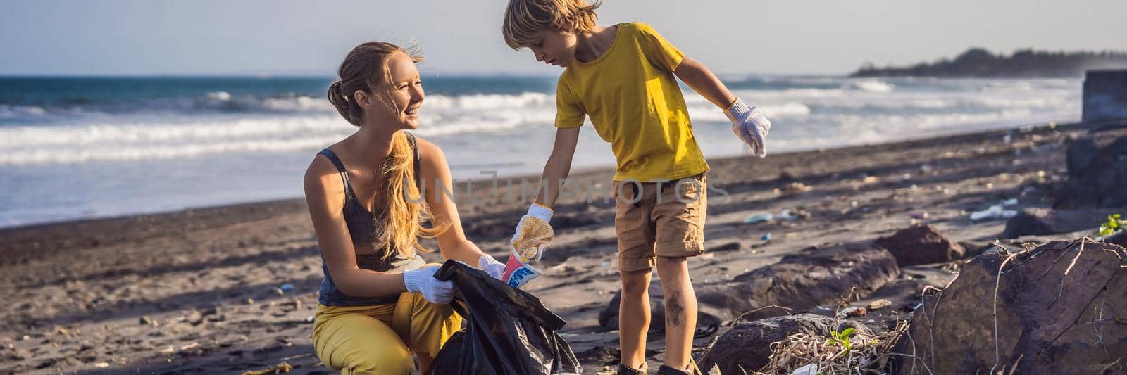 Mother and son are cleaning up the beach. Natural education of children. BANNER, LONG FORMAT