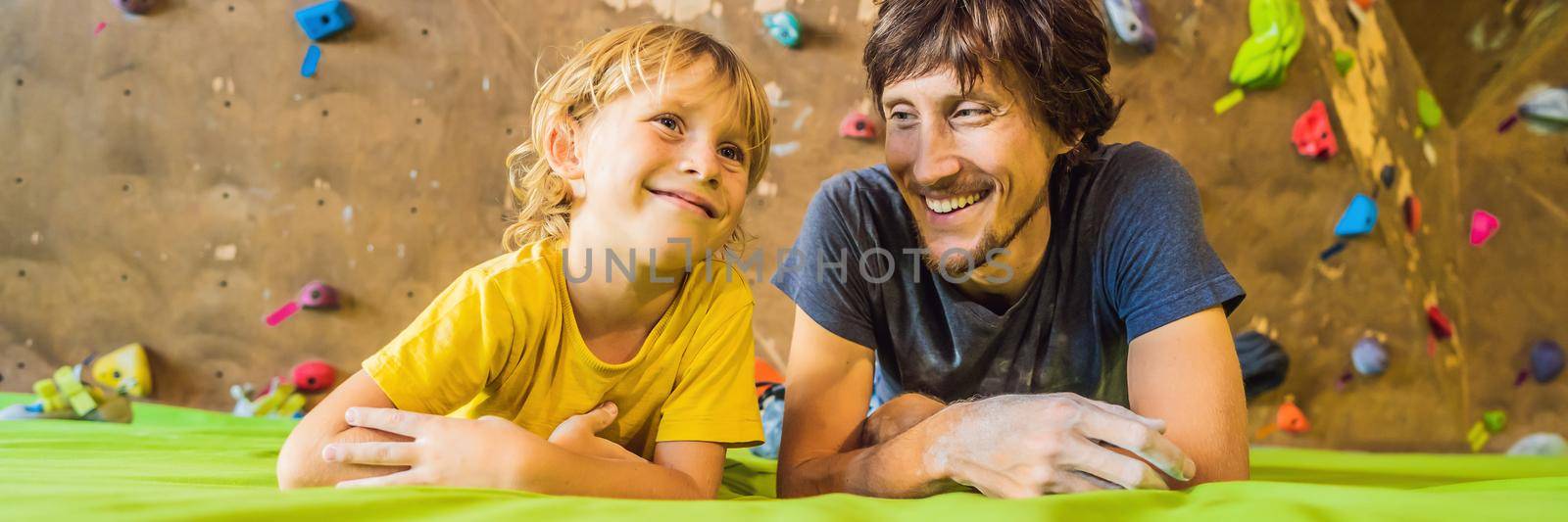 Dad and son at the climbing wall. Family sport, healthy lifestyle, happy family BANNER, LONG FORMAT by galitskaya