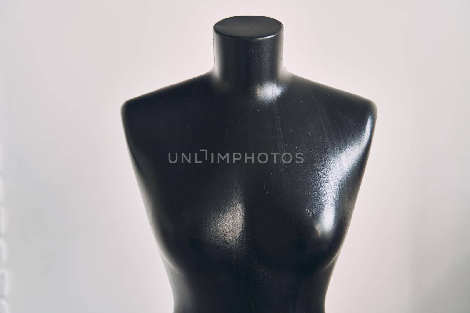 Black female mannequin for clothing on white background. High quality photo