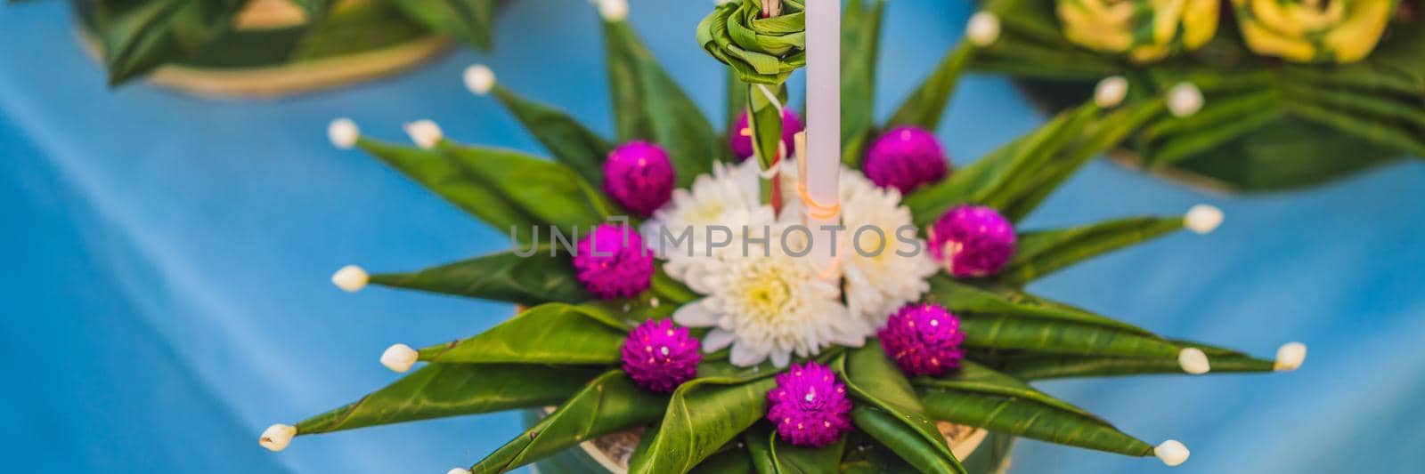 Loy Krathong festival, People buy flowers and candle to light and float on water to celebrate the Loy Krathong festival in Thailand BANNER, LONG FORMAT by galitskaya