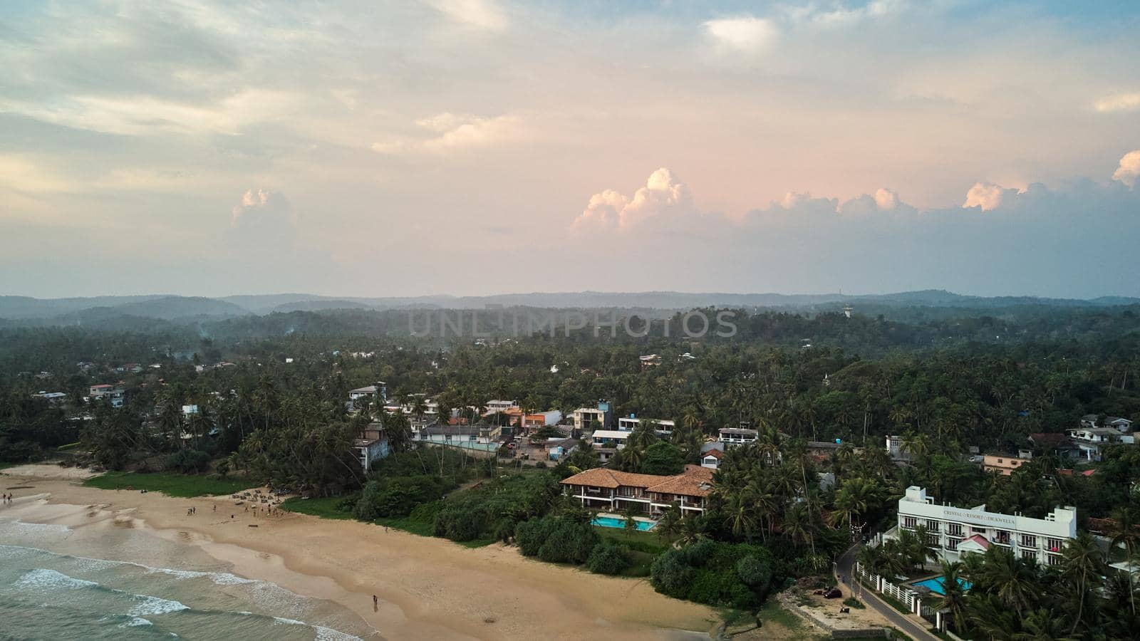 Aerial view of an emerald green sea and big foaming waves. Indian Ocean. Dikwella beach. Sri Lanka. High quality photo