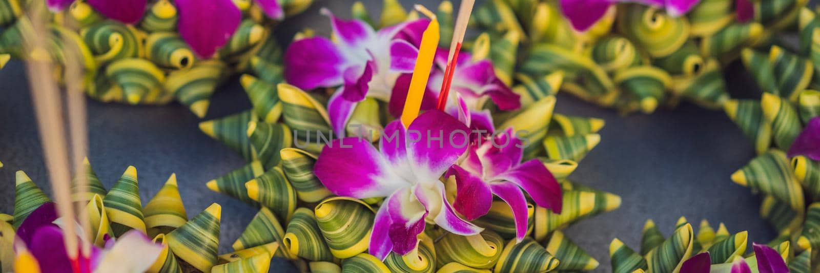 Loy Krathong festival, People buy flowers and candle to light and float on water to celebrate the Loy Krathong festival in Thailand BANNER, LONG FORMAT by galitskaya