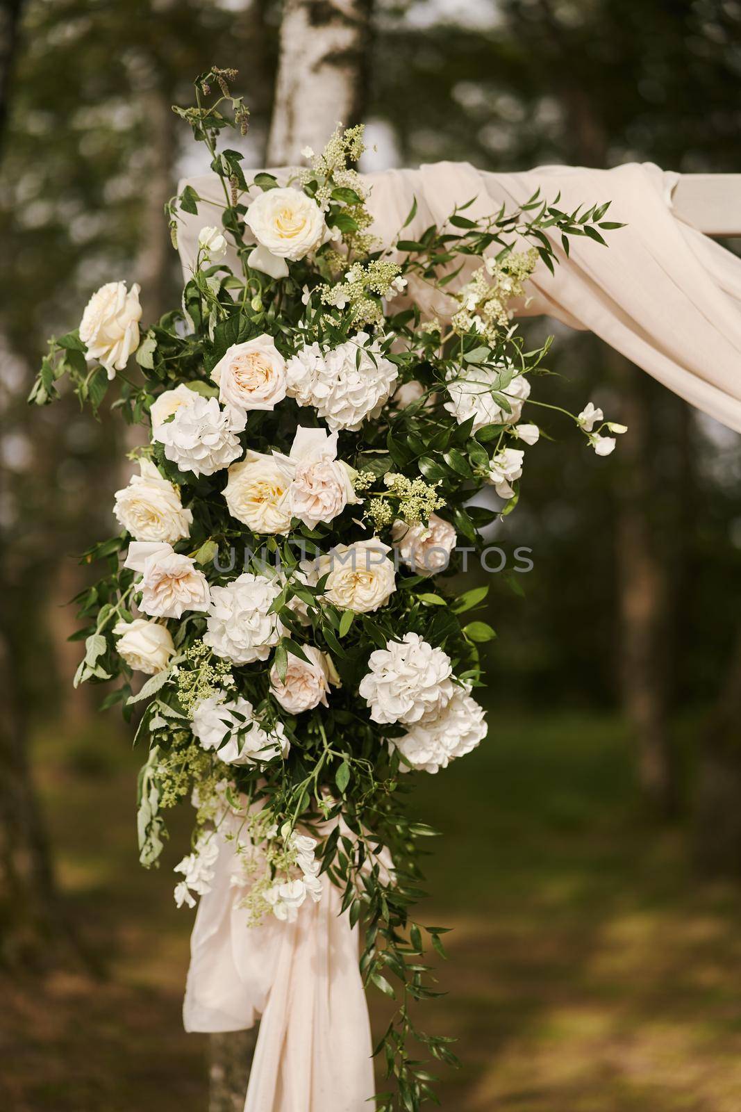 Wedding decorations. Flowers on the wedding arch. Decoration of a wedding celebration. by driver-s