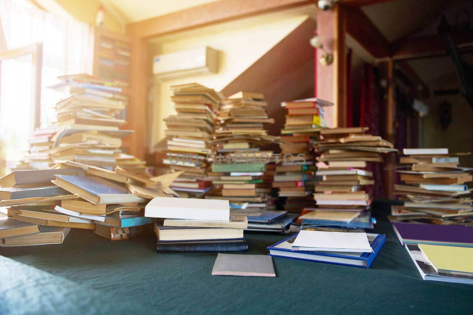 Pile of old books on the table. Lots of old books. Copy space