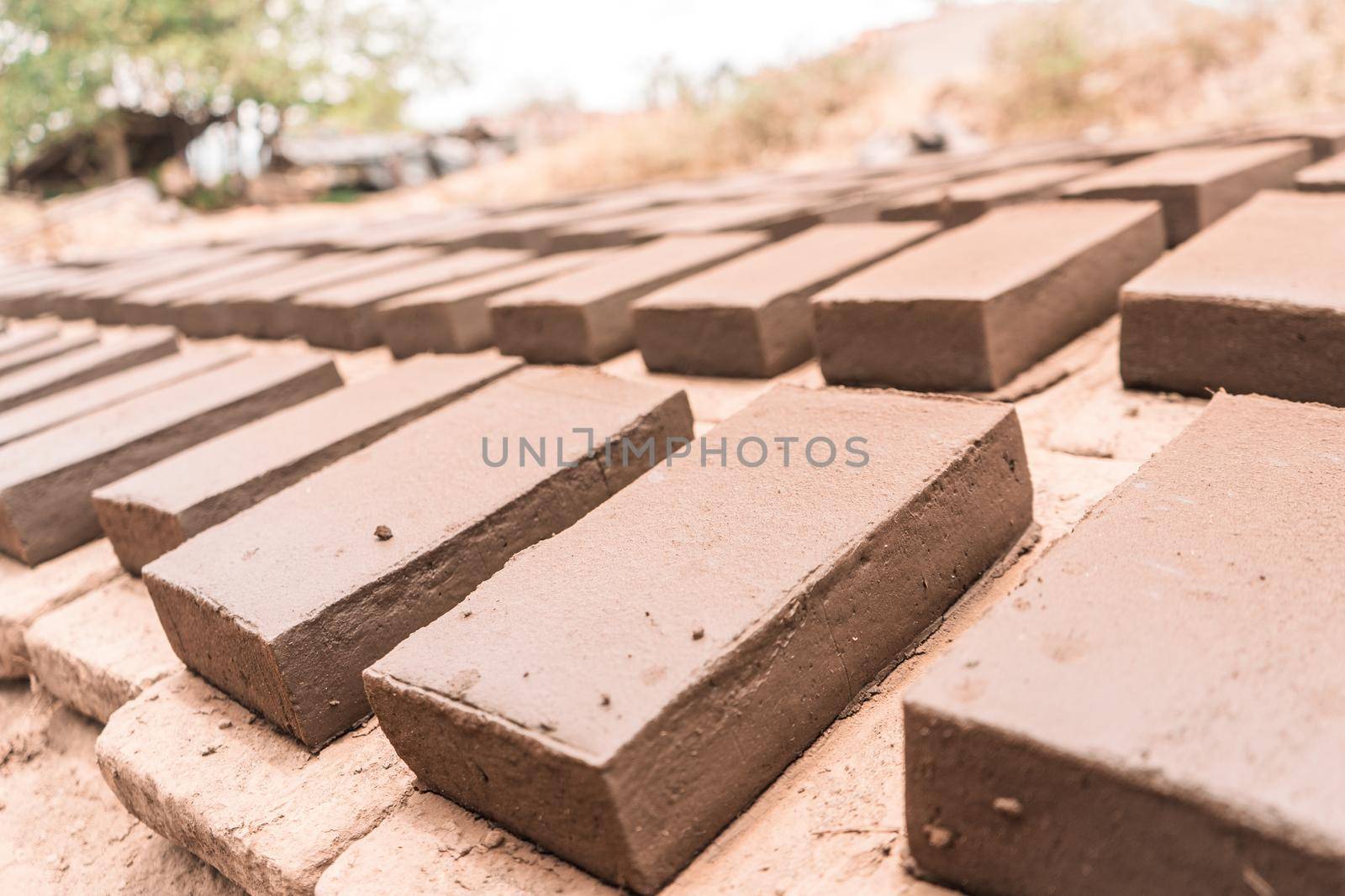 Clay bricks on the ground drying in the sun in an artisan workshop in La Paz Centro Nicaragua