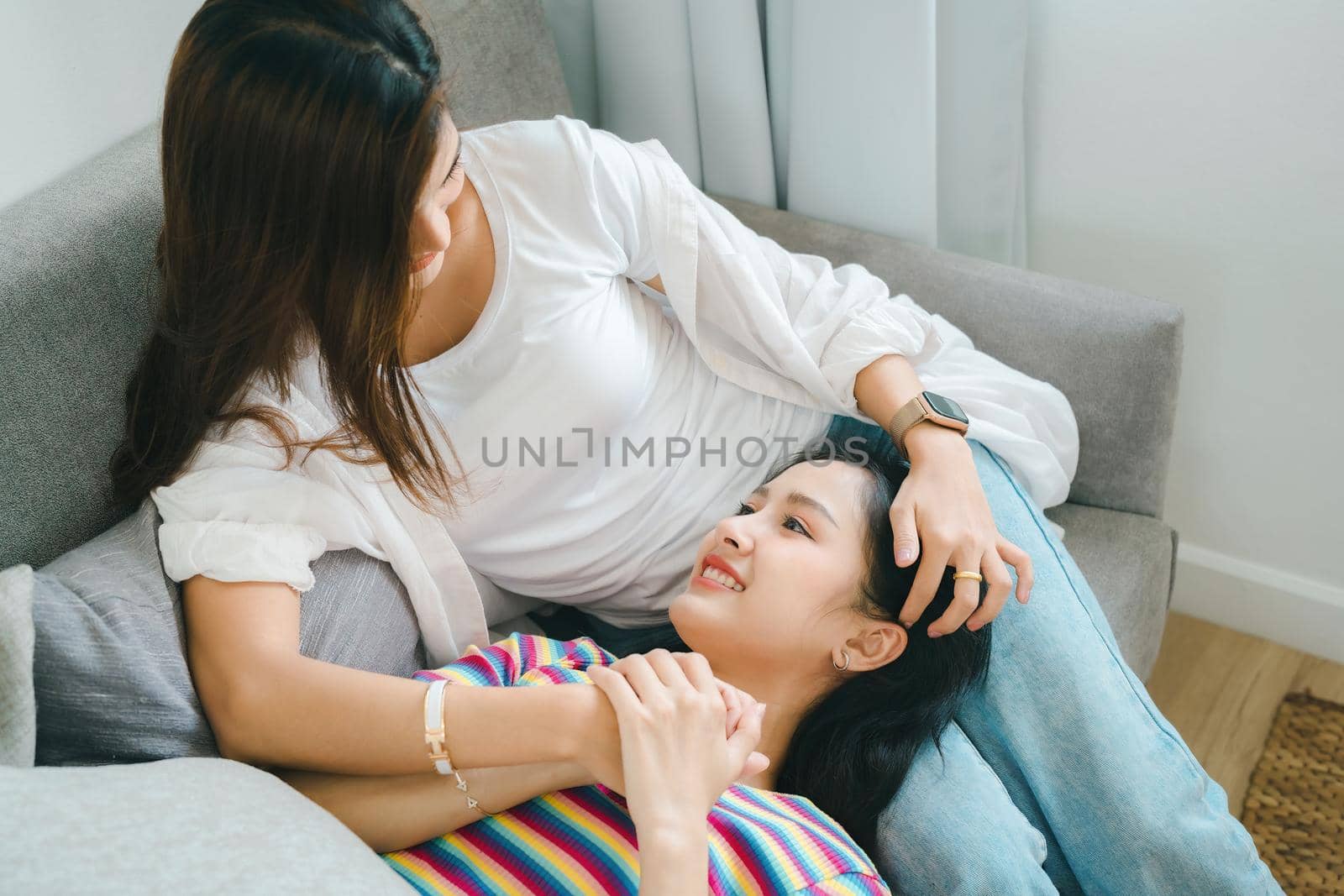 lgbtq, lgbt concept, homosexuality, portrait of two Asian women posing happy together and showing love for each other while being together.