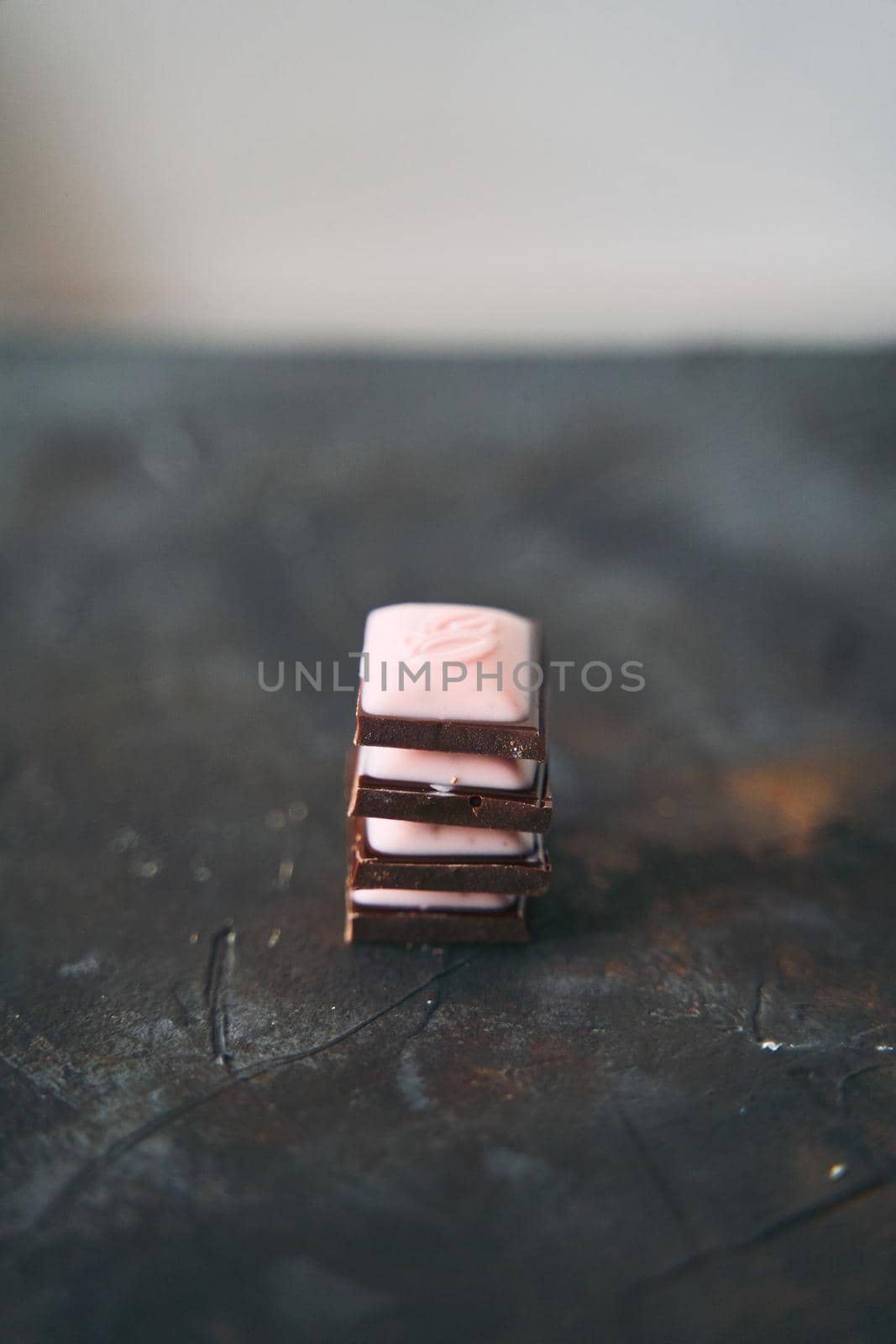 Selective Focus on Four Chocolate Slices on a Dark Background. High quality photo