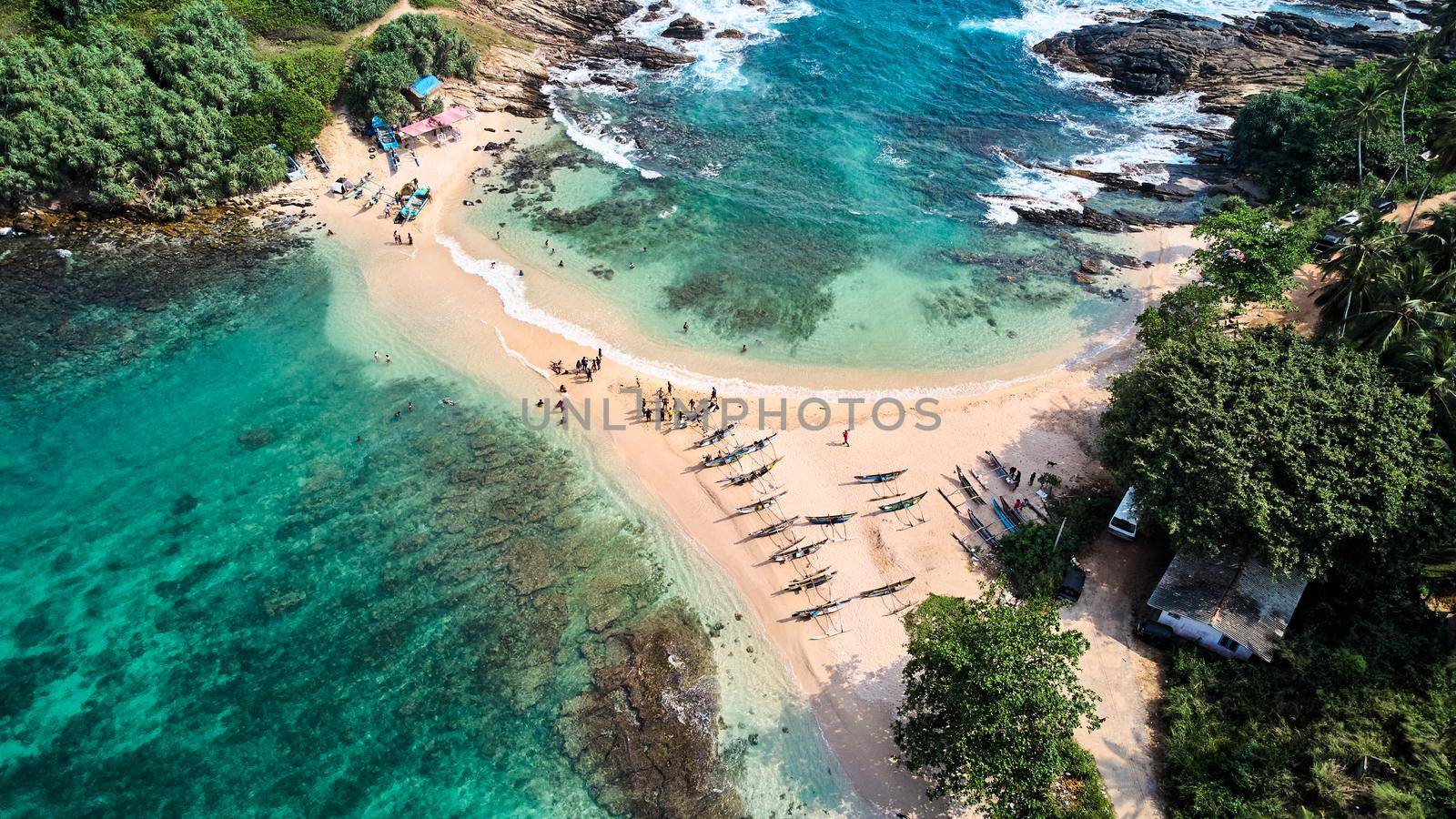 Aerial view of blue beach island. Drone view of the beaches of Sri Lanka. High quality photo