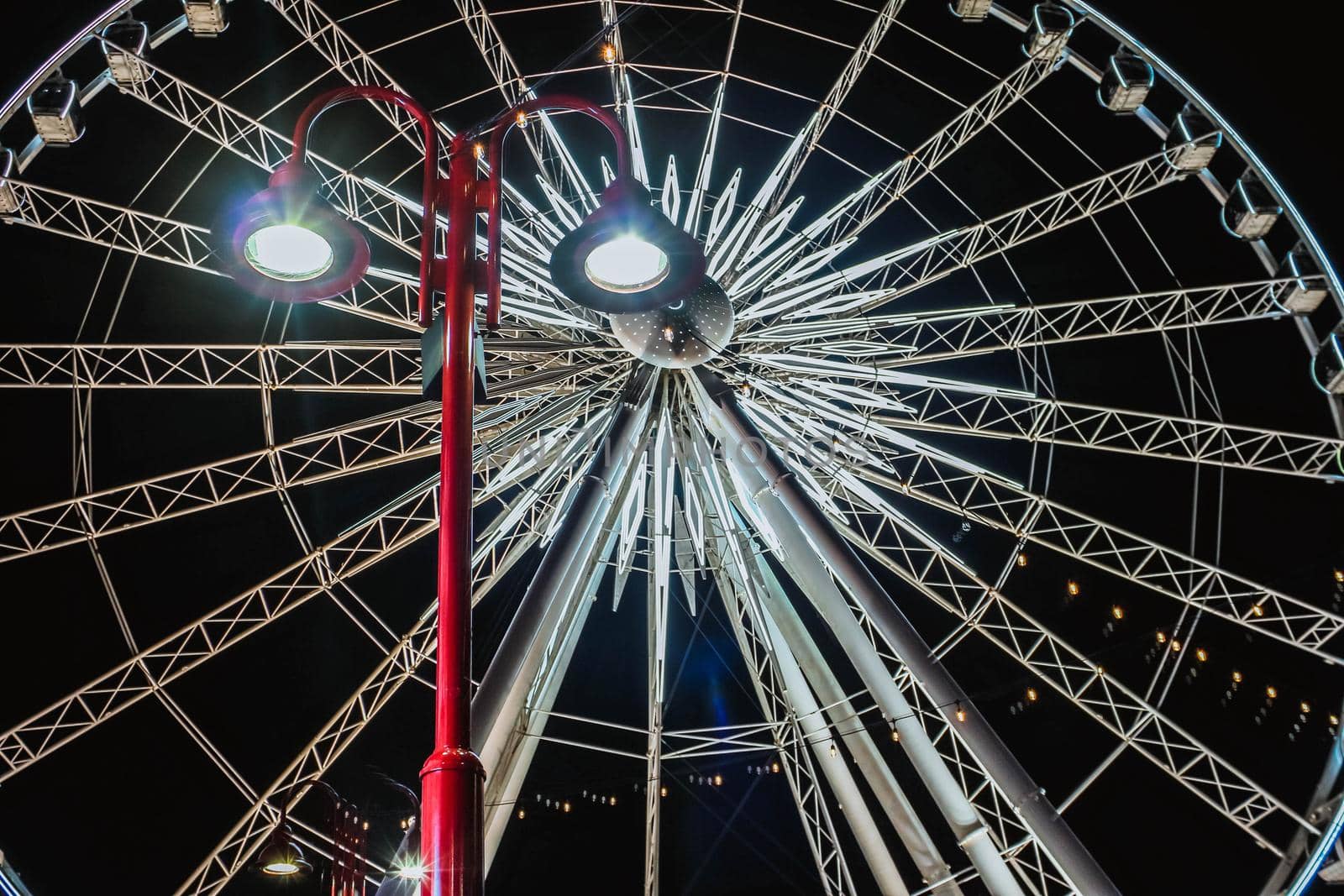 Huge observation wheel at night. View from above.