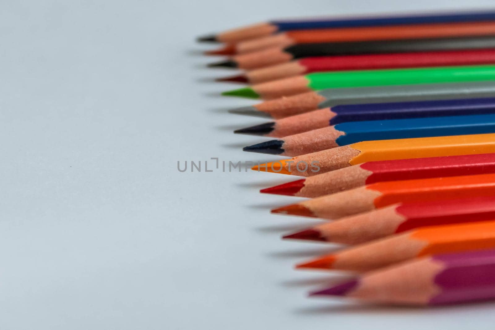 Color pencil with copy space isolated on white background,education frame concept. by JuliaDorian