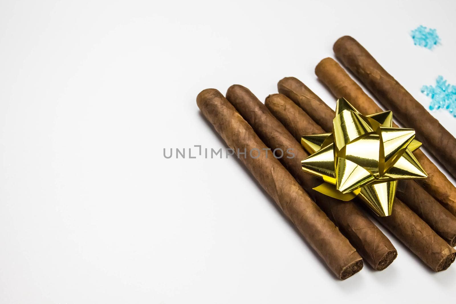 Cigars as a gift on white background. Cigars with gold bow. by JuliaDorian