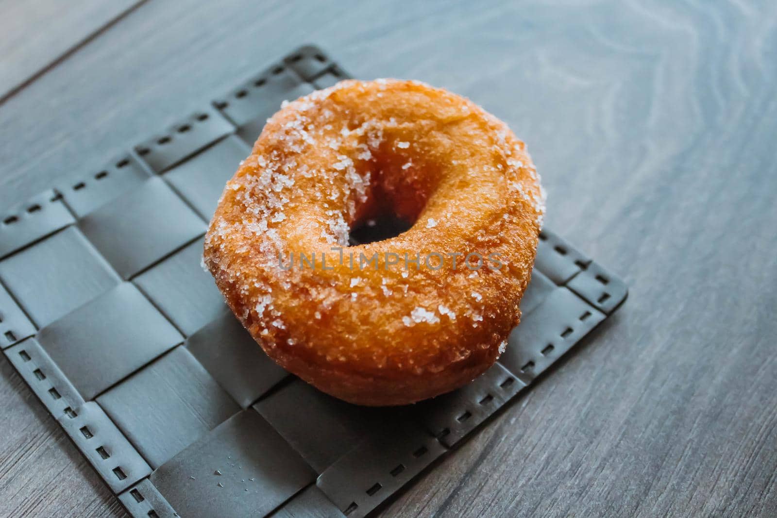 Sweet sugar donut on a wooden background by JuliaDorian