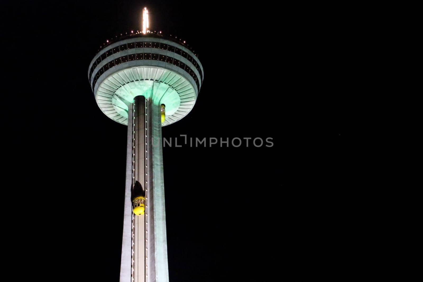 Niagara Falls, Ontario Canada - August 29, 2019: Skylon Tower Illuminated at Night in Niagara Falls