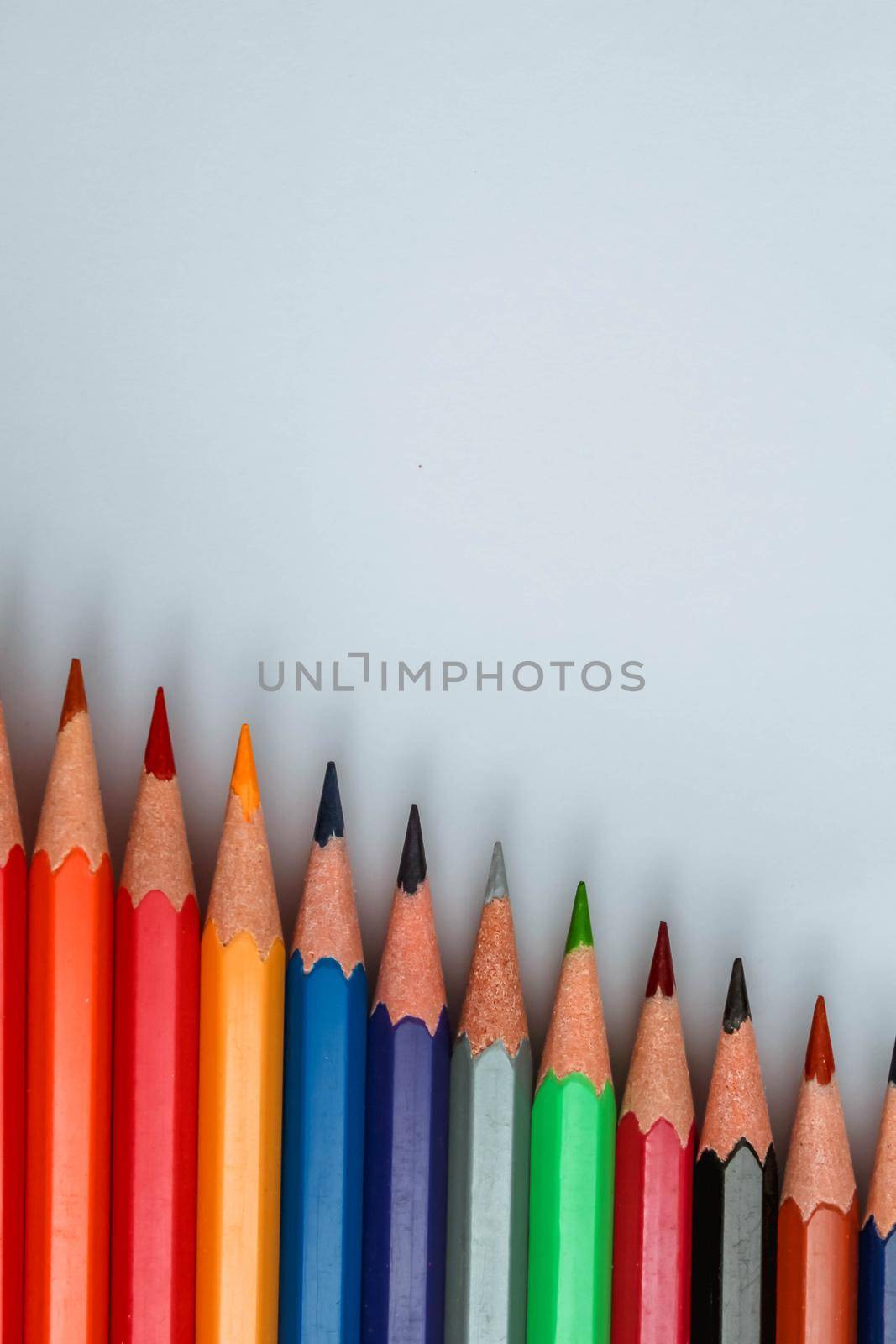 Set of rainbow color wooden pencil collection isolated on white vertical background by JuliaDorian