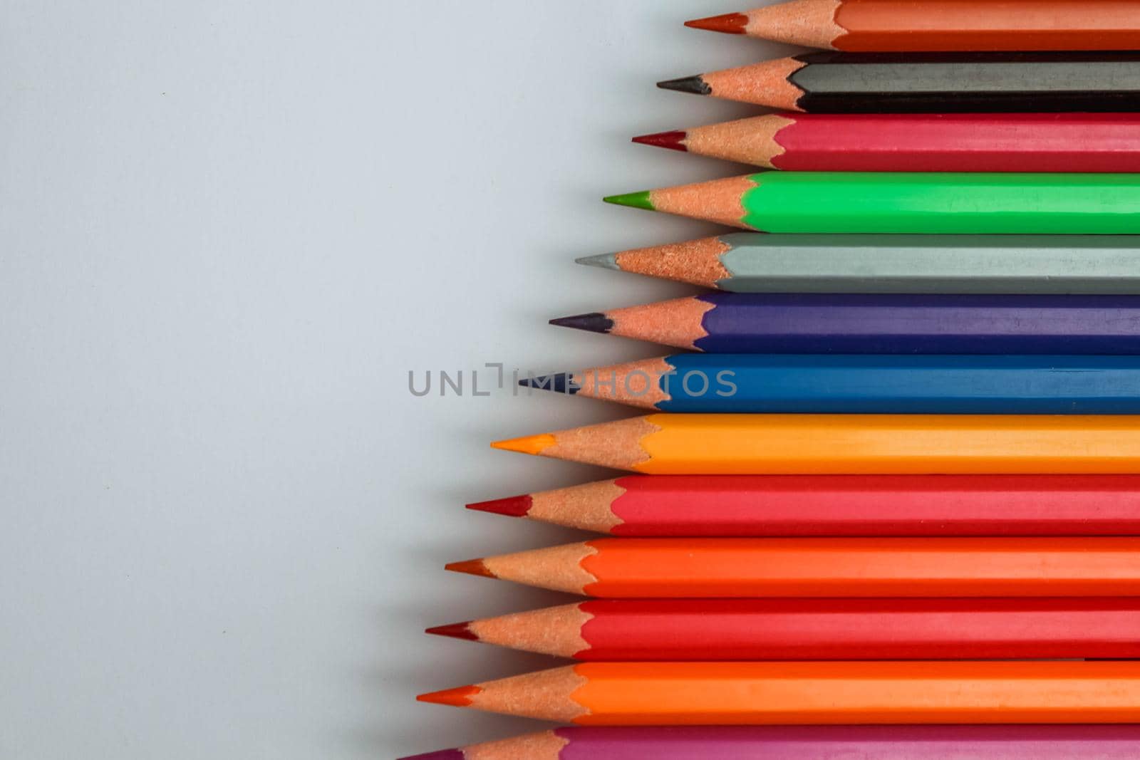 Color pencil with copy space isolated on white background,education frame concept. by JuliaDorian