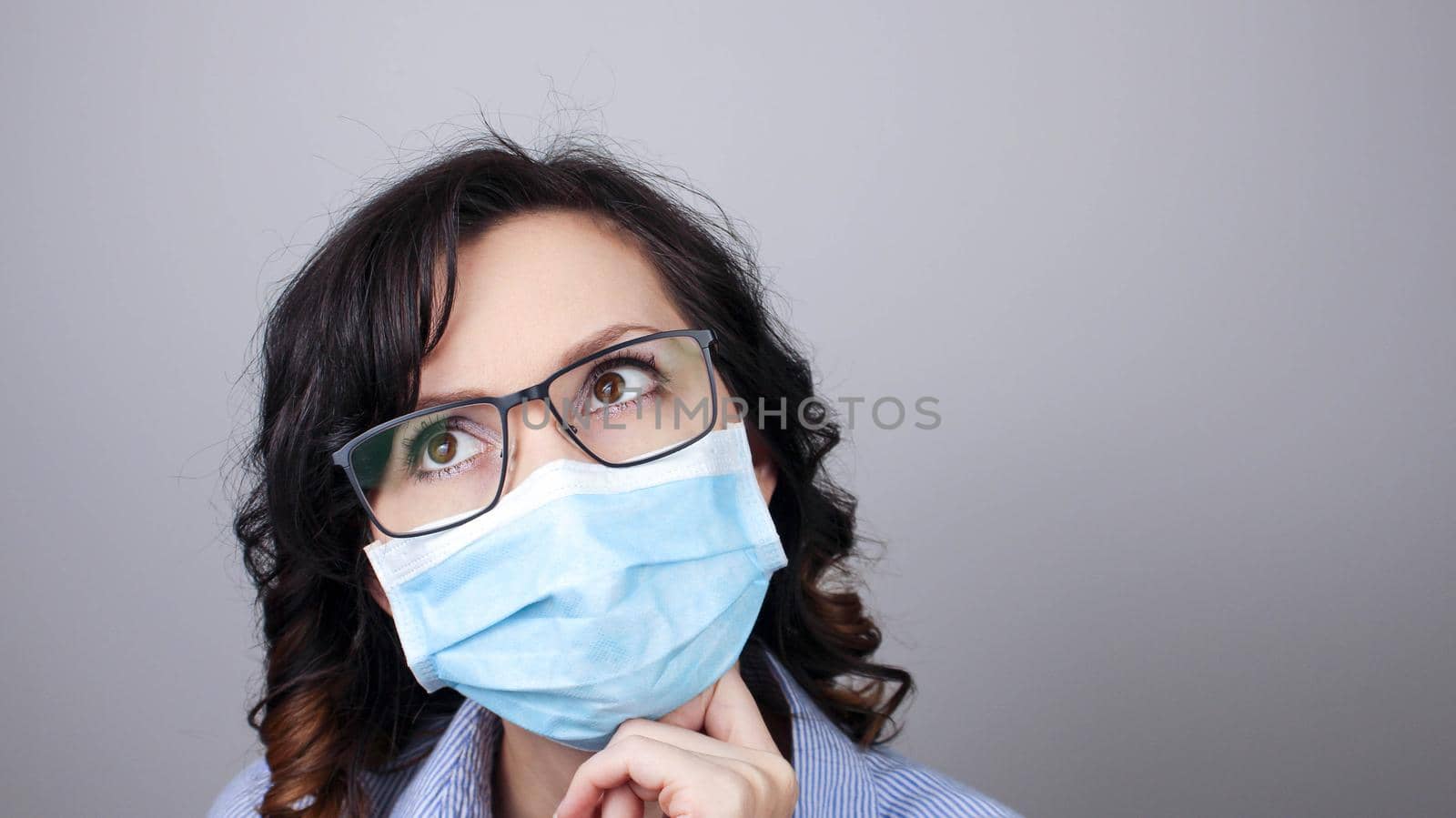Woman wearing protection face mask against coronavirus. Woman in a mask and glasses. Medical mask, Close up shot, Select focus, Prevention from covid19