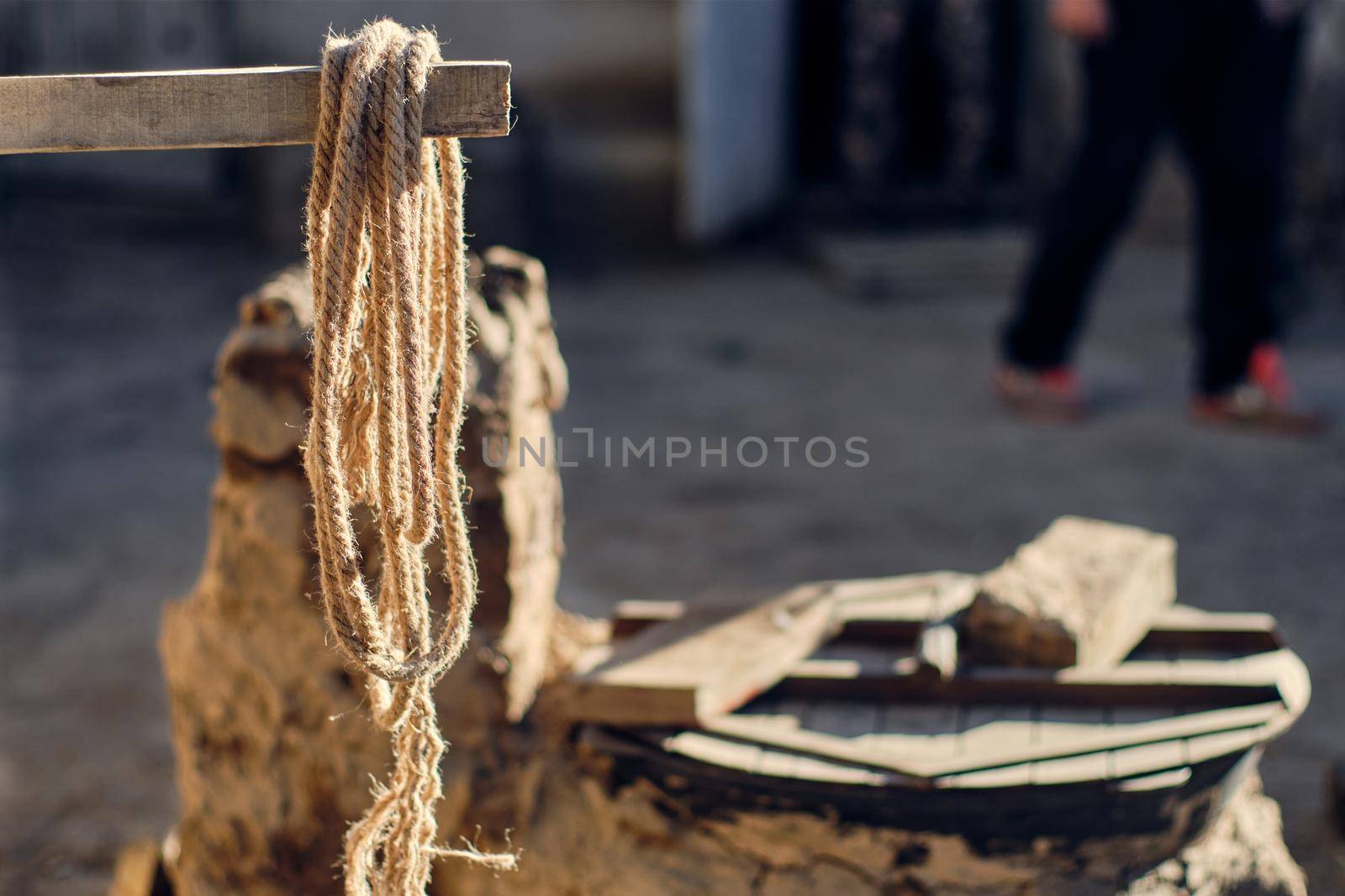 Clay stove, rural life, rope hanging on a bar, the sun shines, early morning