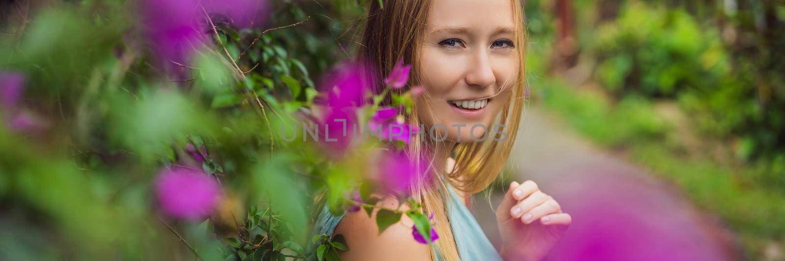 Young woman tourist in Bali walks along the narrow cozy streets of Ubud. Bali is a popular tourist destination. Travel to Bali concept BANNER, LONG FORMAT by galitskaya