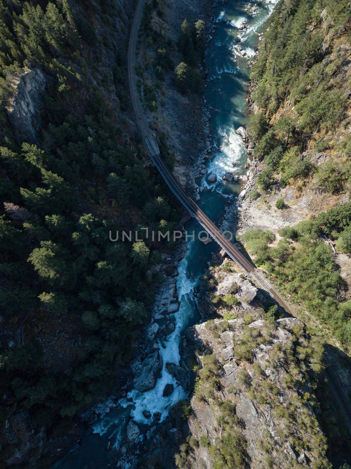 Aerial View of River flowing in canyon. Canadian Mountain Landscape, View from above. British Columbia, Canada. Nature Background