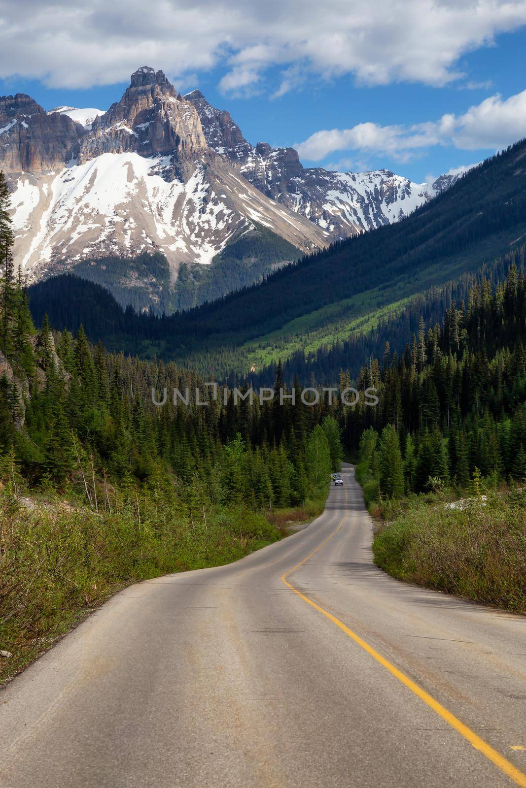 Scenic road in the Canadian Rockies during a vibrant sunny summer day by edb3_16