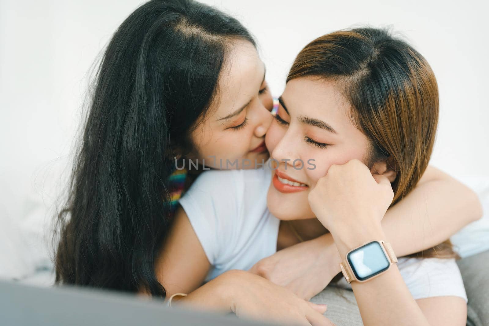 lgbtq, lgbt concept, homosexuality, portrait of two Asian women posing happy together and showing love for each other while being together by Manastrong