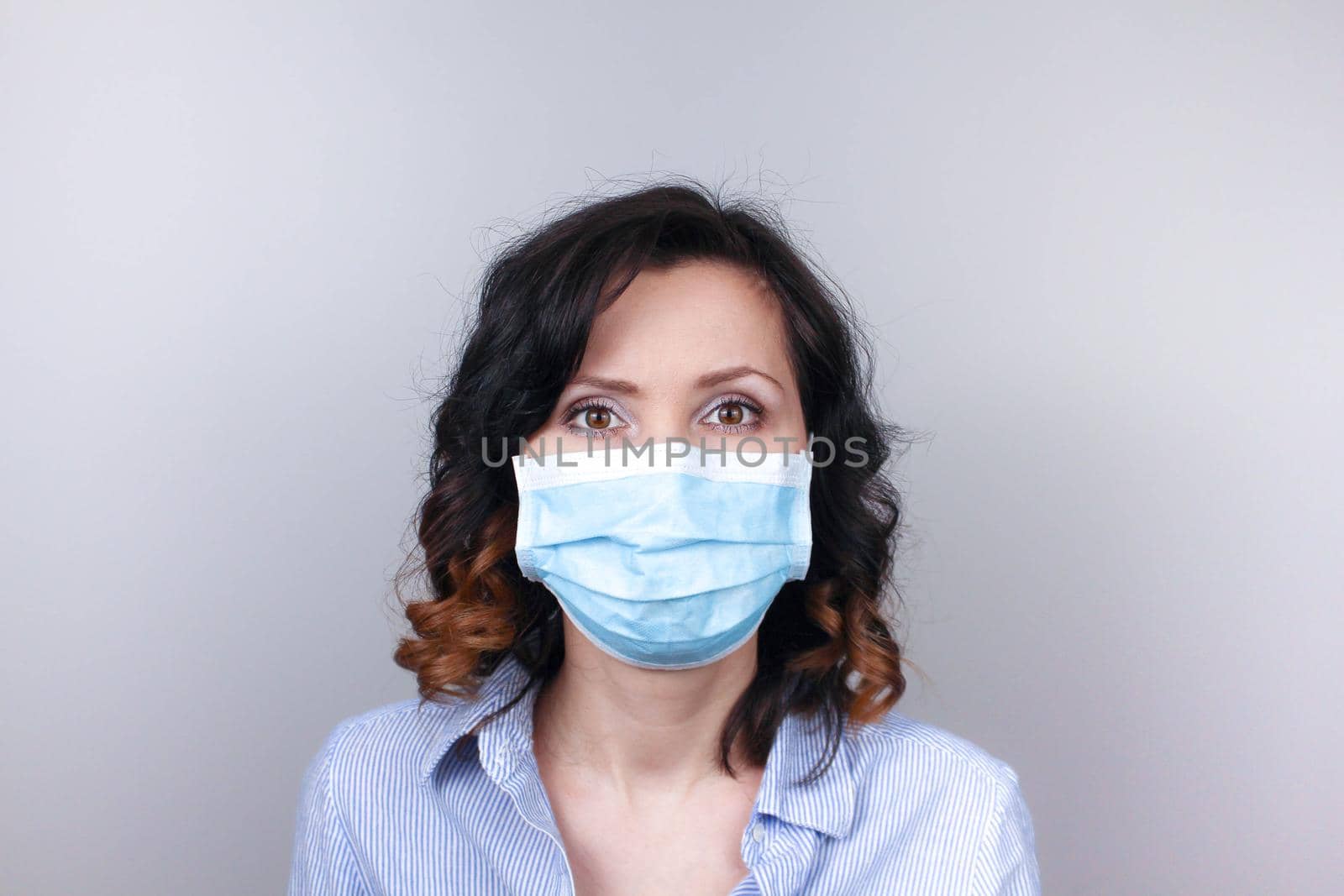 Woman wearing protection face mask against coronavirus. Woman in a mask and glasses. Medical mask, Close up shot, Select focus, Prevention from covid19