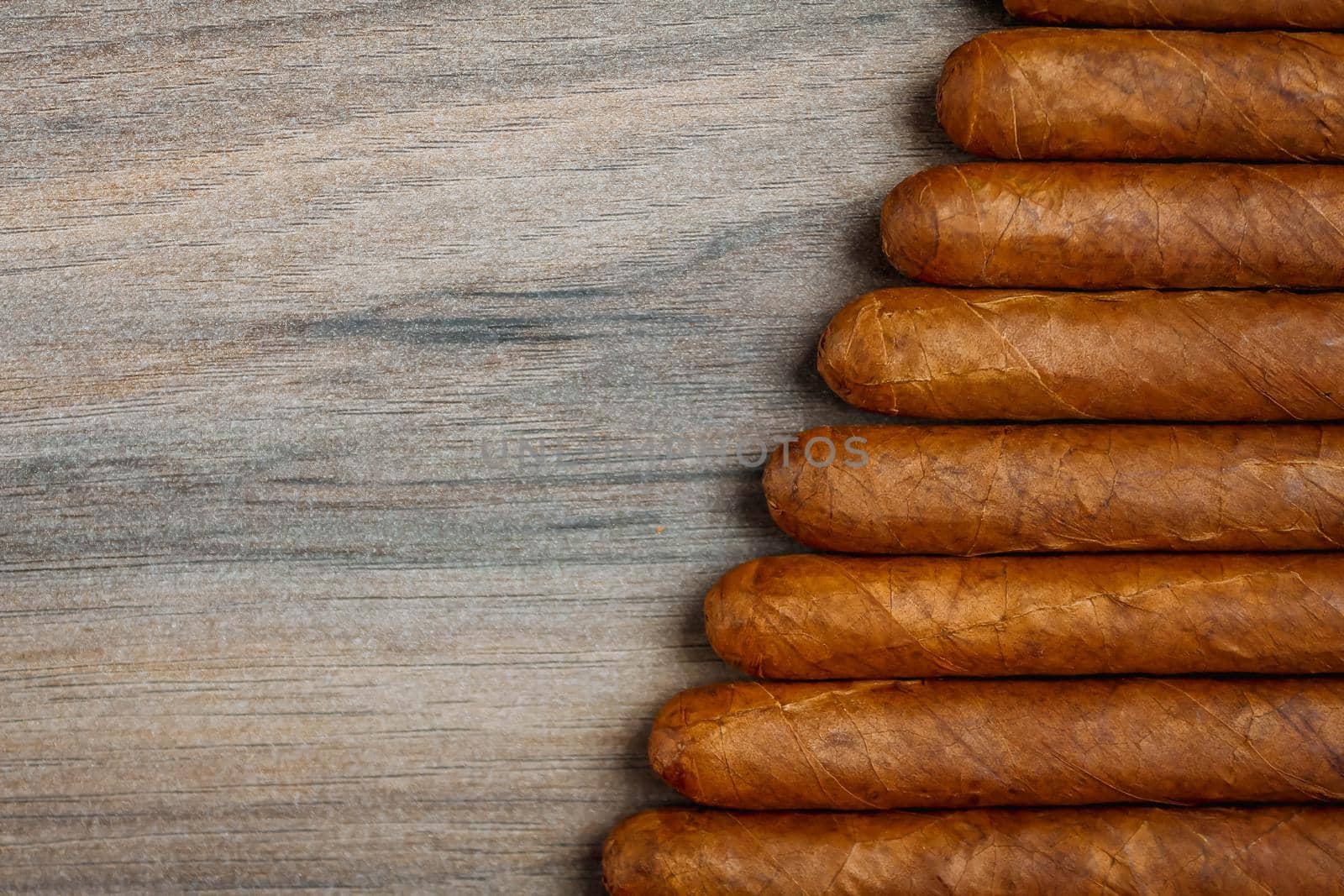 Cigars on the wooden background