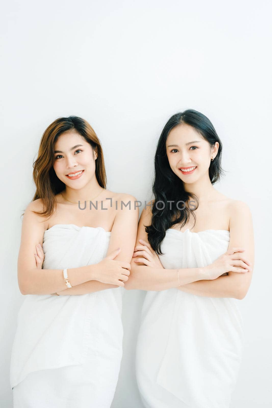 lgbtq, LGBT concept, homosexuality, portrait of two Asian women posing happy together and showing love for each other while taking a shower by Manastrong