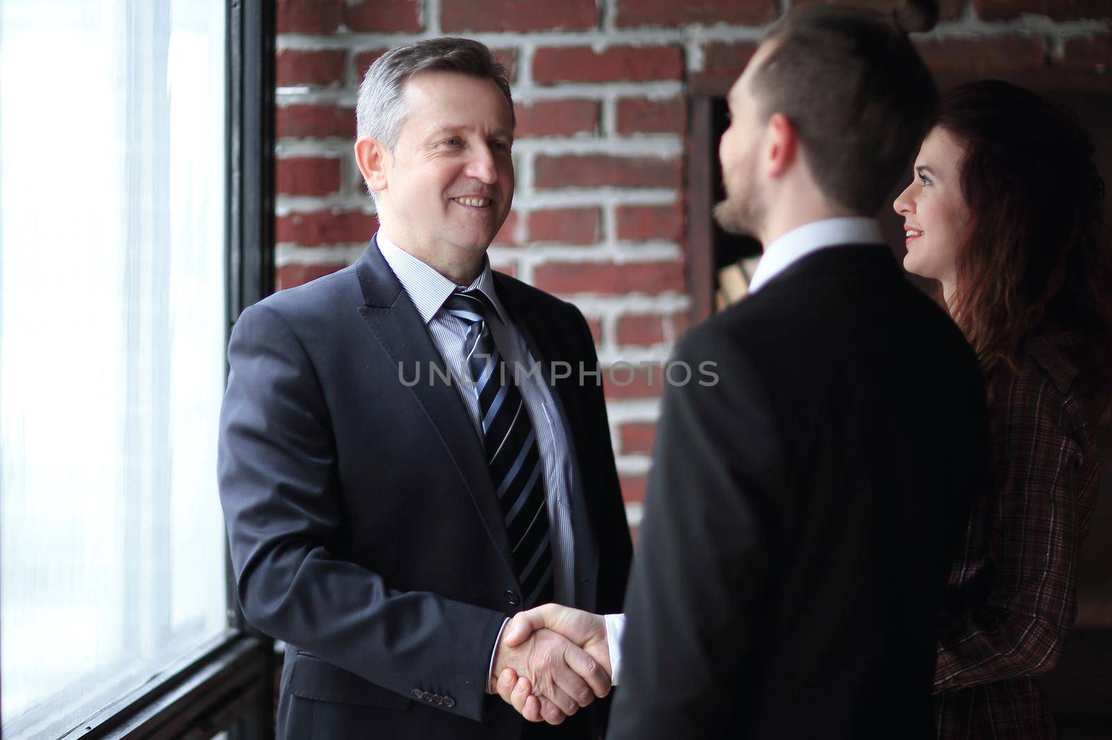 meeting of two companions in the office.the concept of cooperation